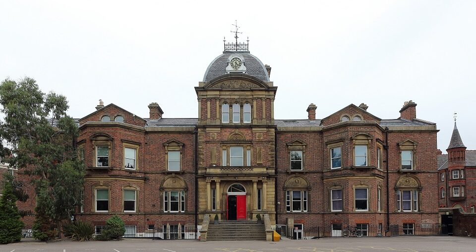 Blackburne House - A large red brick building with a red door.